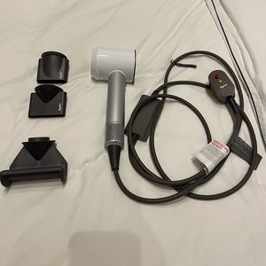 Dyson White and Silver Hair Dryer with Dark Gray Attachments